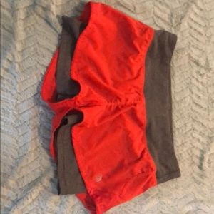 Orange and gray running shorts